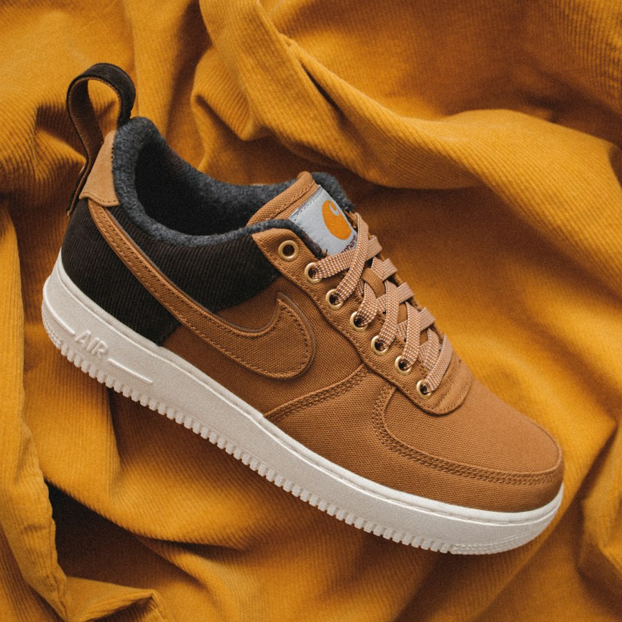 Tan duck-canvas low top resting on mustard fabric