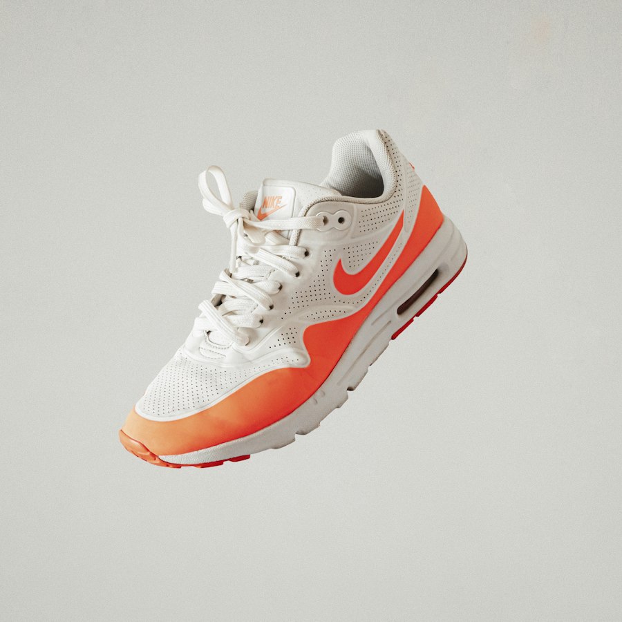 White and orange runner floating against grey